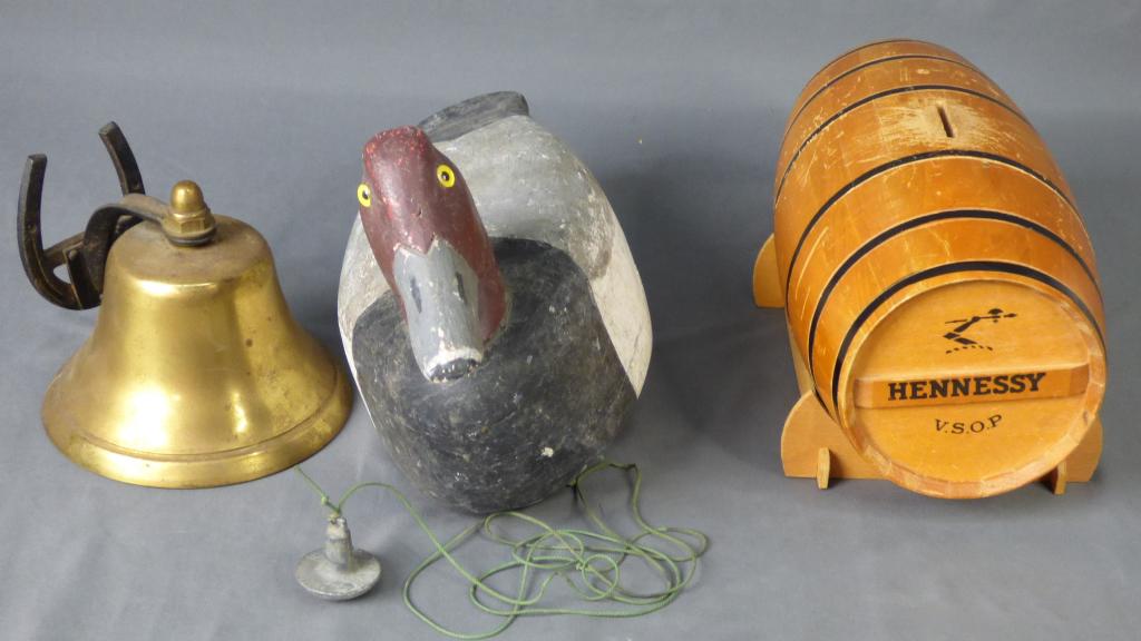 Brass Horse Shoe Bell, Duck Decoy, Hennessy Barrel: Vintage Brass Horse Shoe Bell; Wooden Duck Decoy with artists initials on bottom and Hennessy Wooden Barrel Bank. Measure 13" x 10" x 7", 10" x 6" x 6" and 7" x 5" x 5". All are in good overall condit