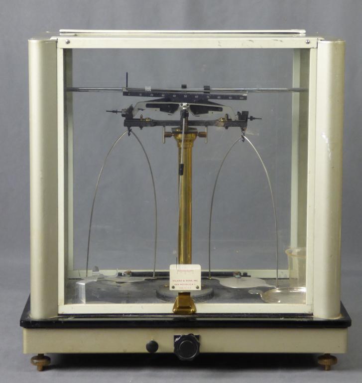 Antique Apothecary Balance Beam Scale by Voland &: Antique apothecary enclosed balance beam scale by Voland & Sons. Appears to be in good overall condition showing some age related wear, untested, unknown if all parts are present.