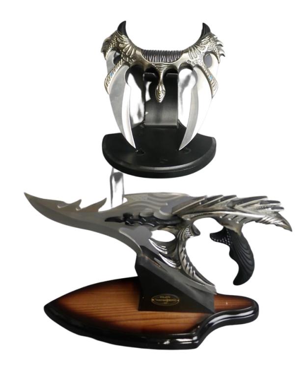 Two Figural Fantasy Hunting Daggers/ Knives: Two Figural Fantasy Hunting Daggers/ Knives with display stands. 12"-8" long. Good Condition.