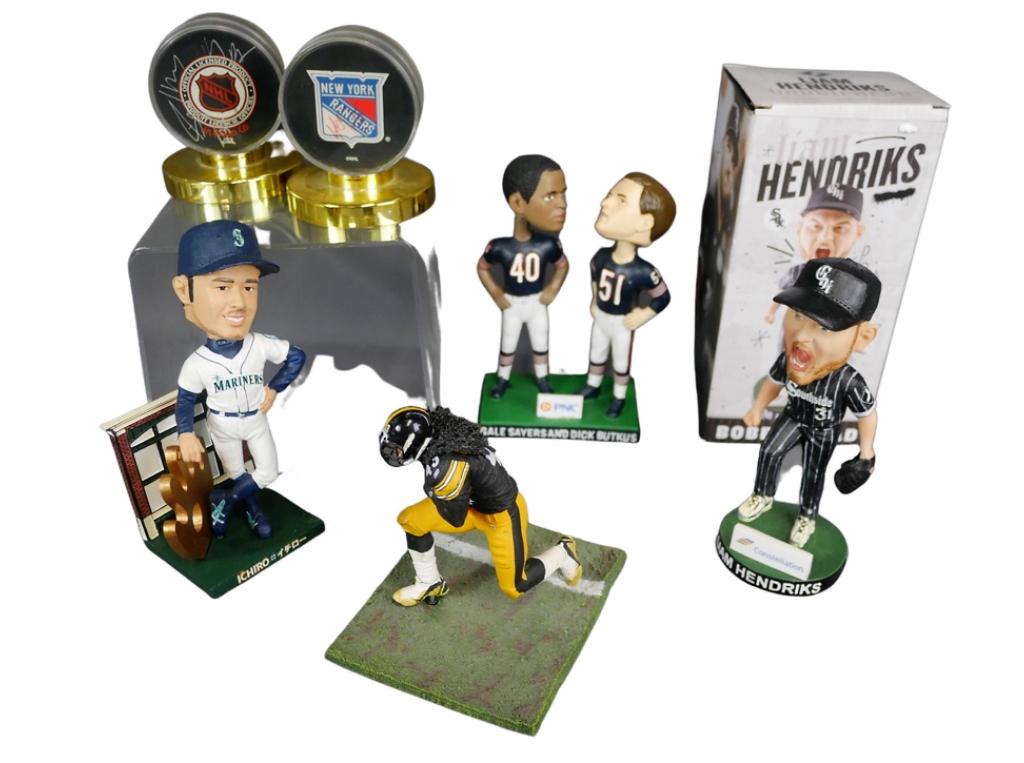 Sport Collectibles- Signed Pucks, Bobbleheads: Group of Sport collectibles including two unsearched Signed Hockey Pucks- one is New York Rangers #29; Ichiro Suzuki Bobblehead; Liam Hendricks Bobblehead; Gayle Sayers & Dick Butkus Bobblehead; McDar