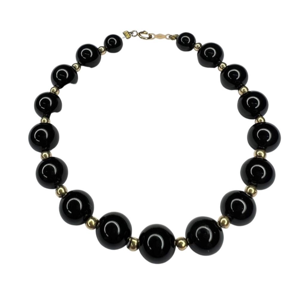 14k Gold & Black Onyx Beads Ladies Bracelet: Black Onyx Beads Bracelet with 14k Gold Beads and Clasps. Measures 7" long. Good Condition.