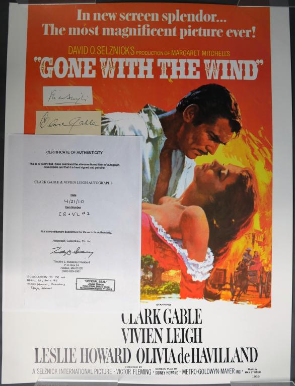 Clark Gable & Vivien Leigh Autographs w/ Poster: Clark Gable and Vivien Leight Autograph/ Signature Cuts with Rolled Gone with the Wind Poster. Come with Certificate of Authenticity. Condition: Good. We truly believe that this item is authentic, but