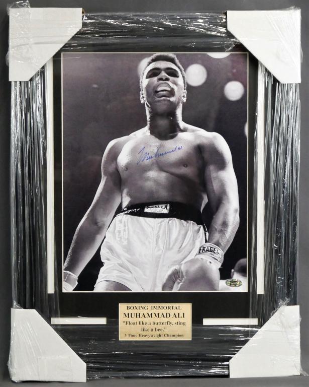 Muhammad Ali Signed/ Autographed Framed Photograph: Muhammad Ali Autographed Phtotograph. Framed- 16" x 21". Comes with Certificate of Authenticity. Condition: Good. Please, note that Esquis Auctions does not have specialists on signatures and cannot g