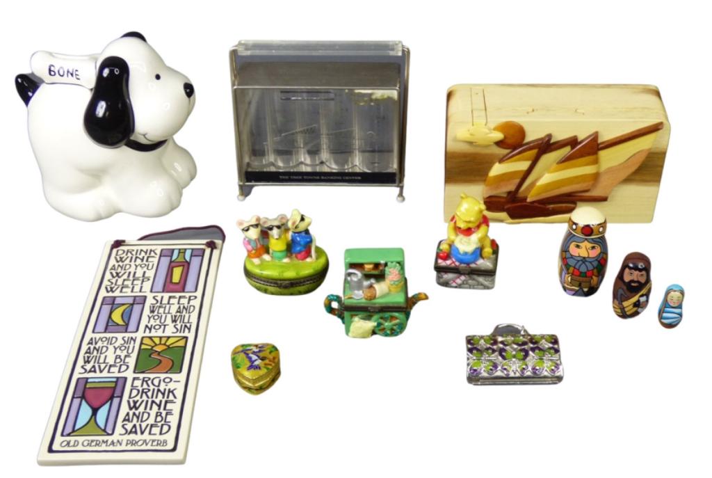 Collectibles- Coin Banks, Porcelain Pill Boxes, Te: Lot of Collectibles including Coin Banks, Porcelain Pill Boxes, Art Tile- Disney, Judith Leiber; Nativity Stocking Dolls; etc.. Good Overall Condition.