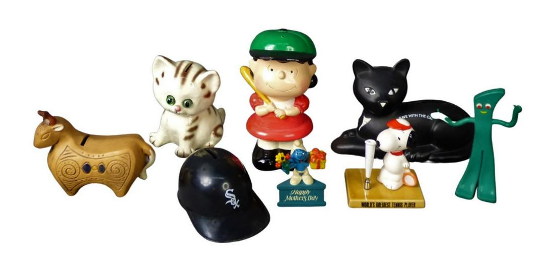 Vintage Figural Coin Banks- Peanuts, Cats, Basebal: Group of Vintage Figural Coin banks including Mid Century Bull Bank; circa 1971 Lucy "Peanuts Bank; Lefton Cat Bank. Lot includes Snoopy Pen Holder, Smerg "Happy Mother Day" Figure, etc.. Good overall