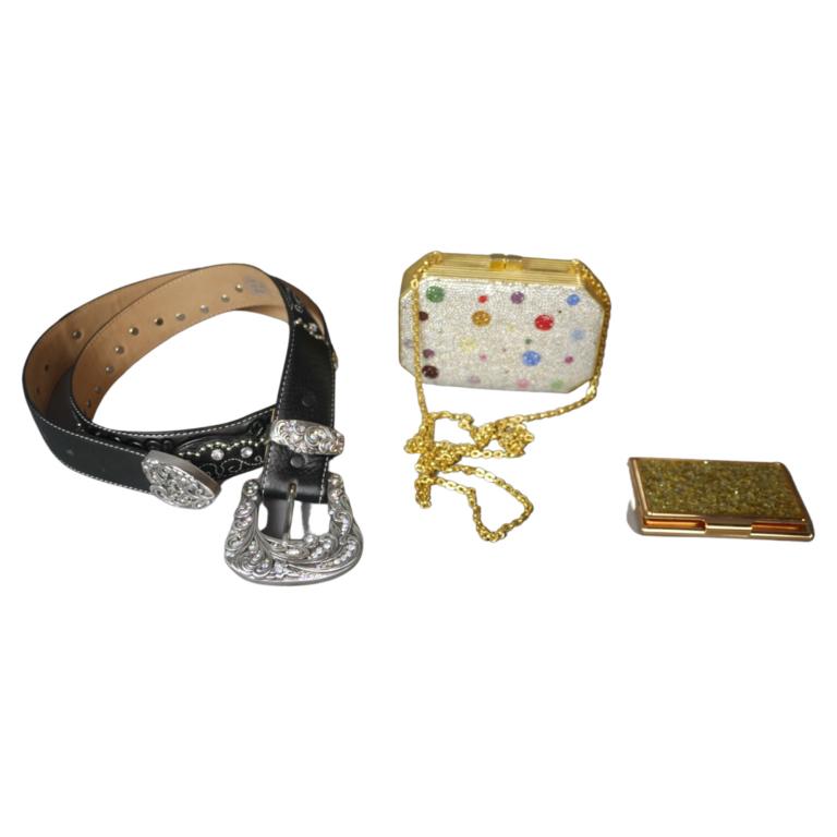 Judith Leiber Designer Clutch, Tony Lama Belt &: Judith Leiber Designer Clutch, Tony Lama Leather Belt and Kate Spade Business Card Holder. Clutch is 5 1/4" x 3 1/2" x 1 1/2". All are in good condition. Esquis Auction does not have specialists on de