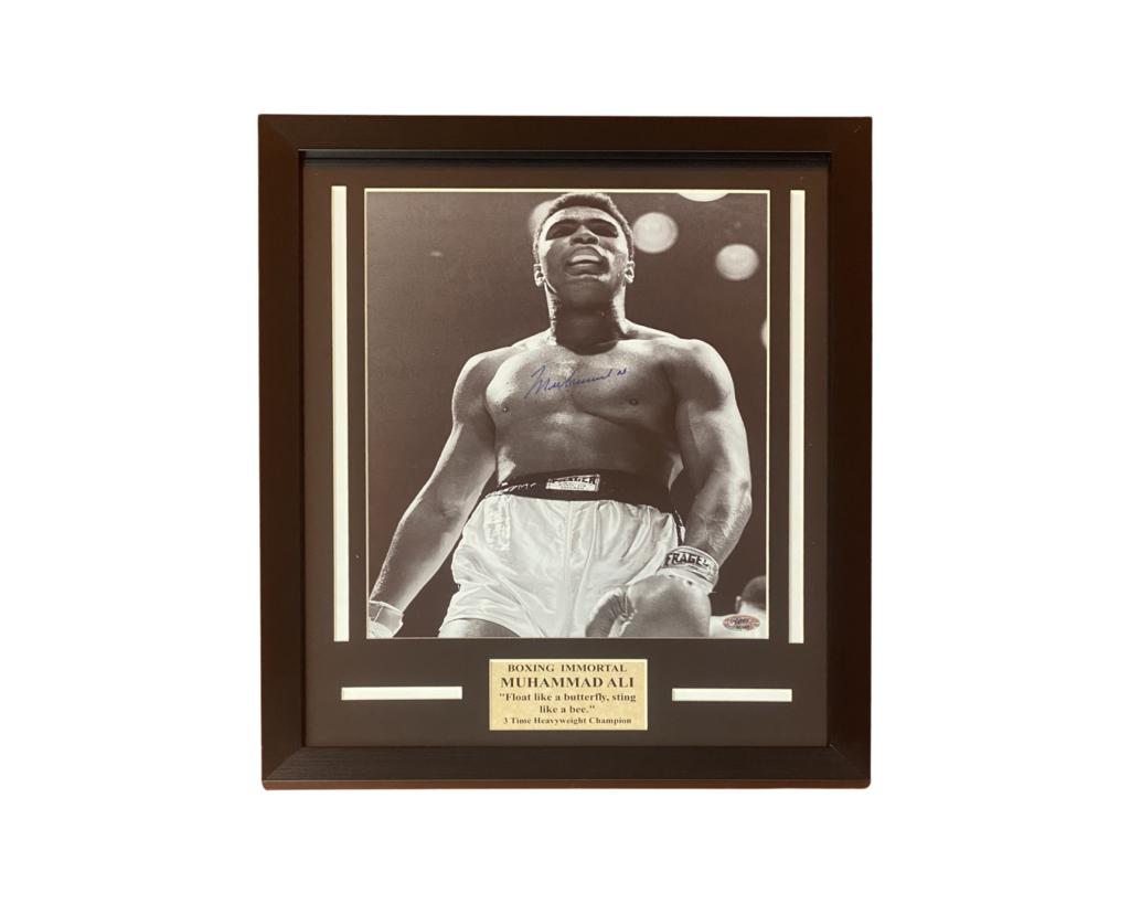 Muhammad Ali Signed/ Autographed Framed Photograph: Muhammad Ali Autographed Phtotograph. Framed- 16" x 21". Comes with Certificate of Authenticity. Condition: Good. Please, note that Esquis Auctions does not have specialists on signatures and cannot g