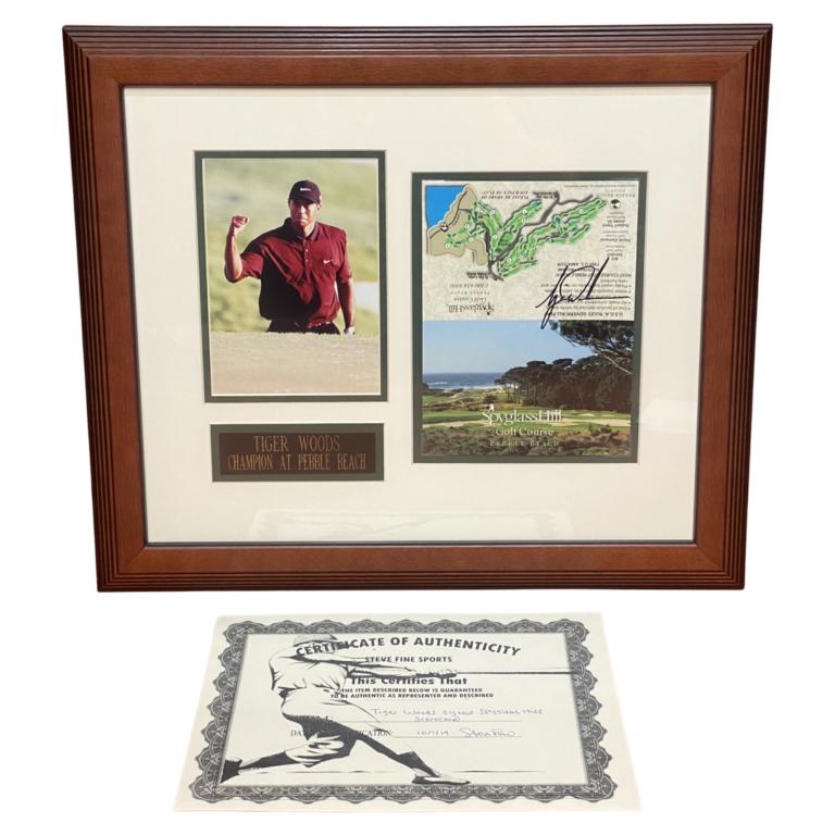 Tiger Woods Autographed Spyglass Hill Score Card: Tiger Woods Signed/ Autographed Spyglass Hill Score Card. Framed with Photograph. 19" x 16 1/2" framed. Comes with Certificate of Authenticity. Condition: Good. We truly believe that this item is auth