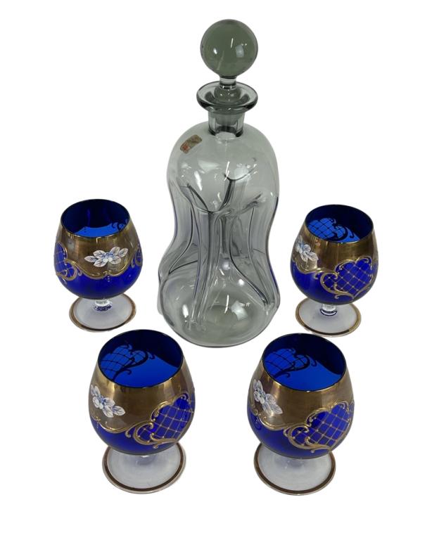 Holmegaard Cluck Cluck Decanter & Bohemian Glasses: Vintage Holmegaard Art Glass Cluck Cluck Decanter and four Bohemian Cobalt Blue Glass Whiskey Glasses with gold hand painted trim. Decanter is 12" tall. Good Condition.