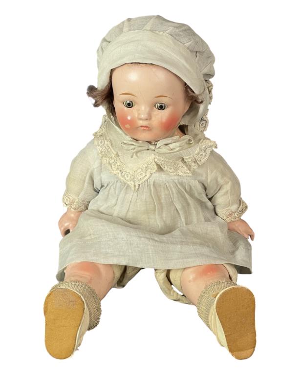 Antique Bisque Porcelain 15" Doll: Antique Bisque Porcelain Doll with Soft Body and opening & closing eyes. Unidentified makers mark on back- starts with "E". 15" tall. Good overall condition with some finish cracks.