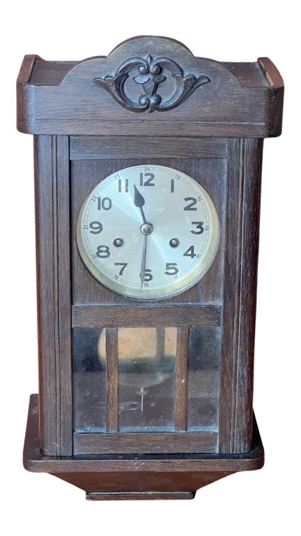 Vintage Kloster German Wall Clock: Vintage Kloster German Wall Clock. Measures 24" x 10". Good overall conditon, comews with key and pendulum, clockworks unknown.