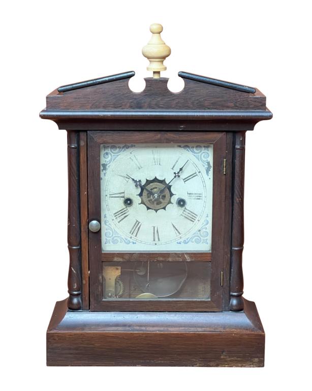 Antique Waterbury Mantel Clock: Antique Waterbury Mantel Clock. 18" x 11 1/2". Good overall condition, comes with pendulum and key, clockworks unknown. New replacement top finial.