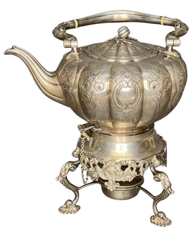 Victorian Antique English Hand Chased Teapot w/ St: Victorian English Hand Chased Teapot with Original Stand. Nicely decorated with iv**y bone inserts at handle. Hallmarked at the bottom. Good Condition.