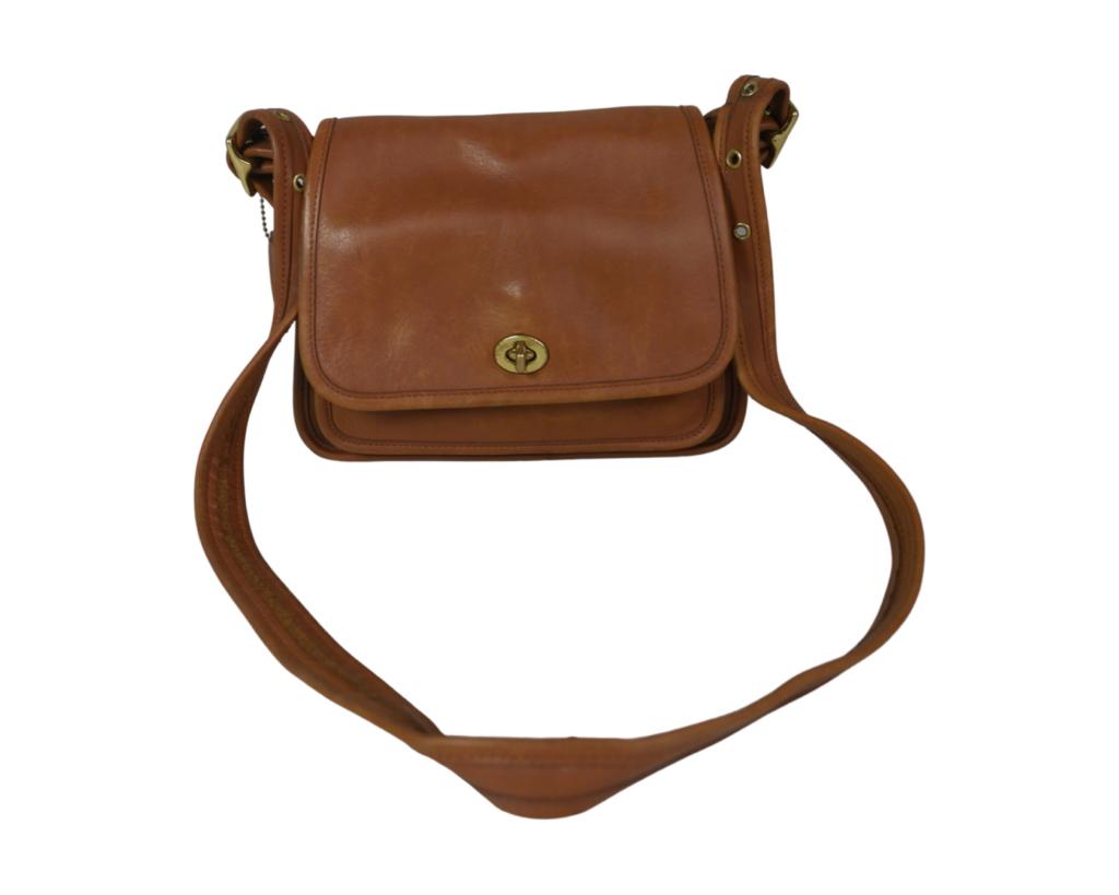 Coach Leather Rambler Legacy Bag/ Purse/ Handbag: Coach Leather Ramblers Legacy Bag/ Purse/ Handbag. 9 1/2" x 8" x 4 1/2". Good Condition. Esquis Auction does not have specialists on designer purses and handbags and we can not guarantee authenticity