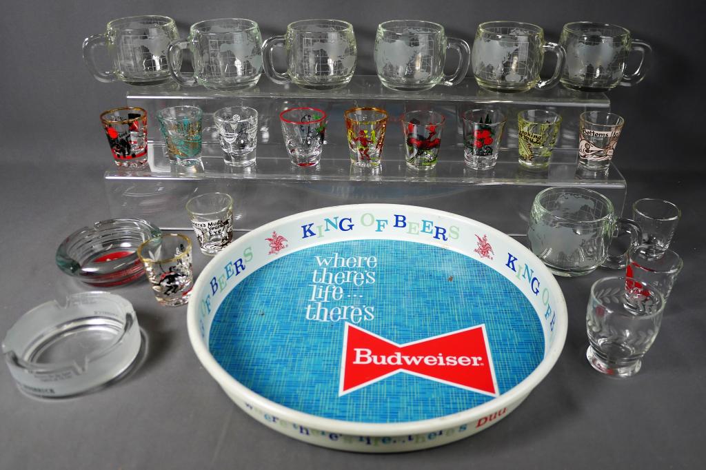Bar Collectibles- Shot Glasses, Ashtrays, Beer Tra: Bar Collectibles- group of vintage various shot glasses; Casino Innsbruck glass ashtray; Stan Mikita's Village Inn glass ashtray; Budweiser Serving Tray and set of Nestle Map Coffee Cups. All are in g