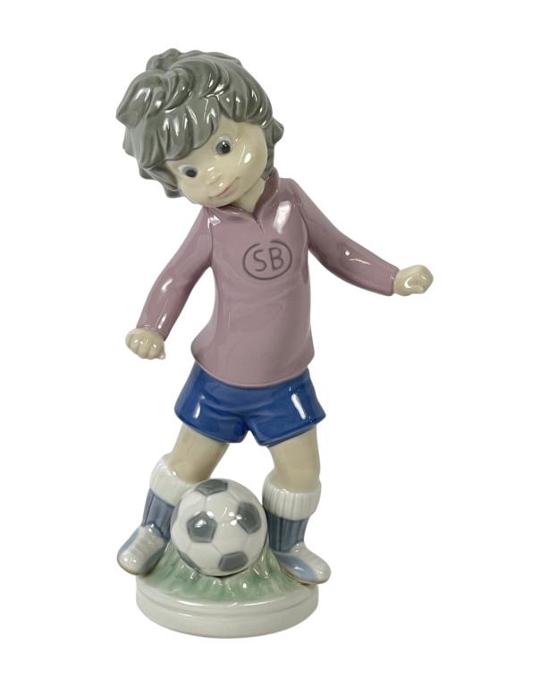Lladro "Sport Billy" Soccer Player Boy Figurine: Lladro "Sport Billy" Soccer Player Boy Figurine. 5135. Measures 9" tall. Good condition.