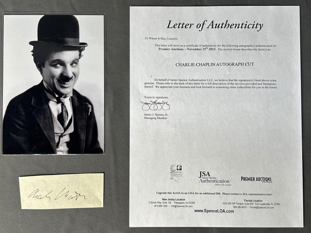 Charlie Chaplin Autograph/ Signature w/ Photo: Charlie Chaplin Autograph/ Signature Cut with 7" x 5" Photograph. Comes with Certificate of Authenticity. Condition: Good. We truly believe that this item is authentic, but Esquis Auctions does not ha