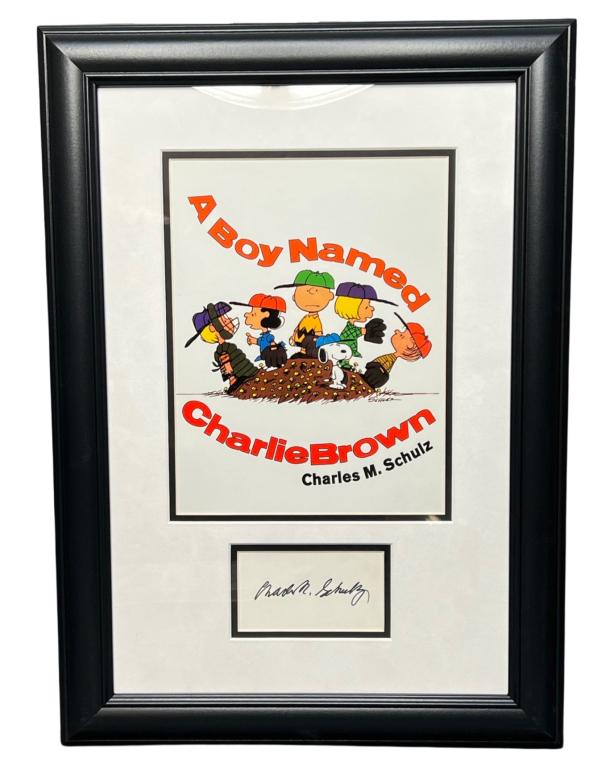 Charles M. Schulz Autograph w/ Peanuts Framed Art: Charles M. Schulz Autograph Cut. Custom Framed with Peanuts Art. 22" x 16" framed. Comes with Certificate of Authenticity. Condition: Good. We truly believe that this item is authentic, but Esquis Auc
