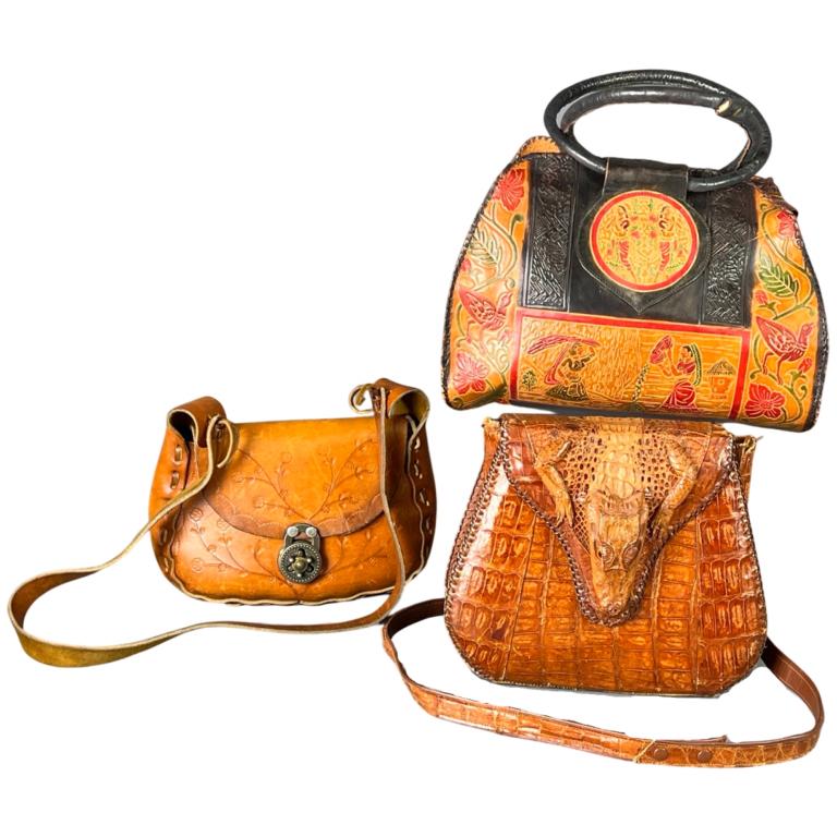 3 Vintage Leather Tooled Handbags- Alligator Head: Vintage Hand Tooled Leather Handbags/ Purses. One is made of Alligator Skin with Gator Head. 13" x 10" x 6", 10" x 8" x 4" and 10" x 7" x 5". Used, show some wear.