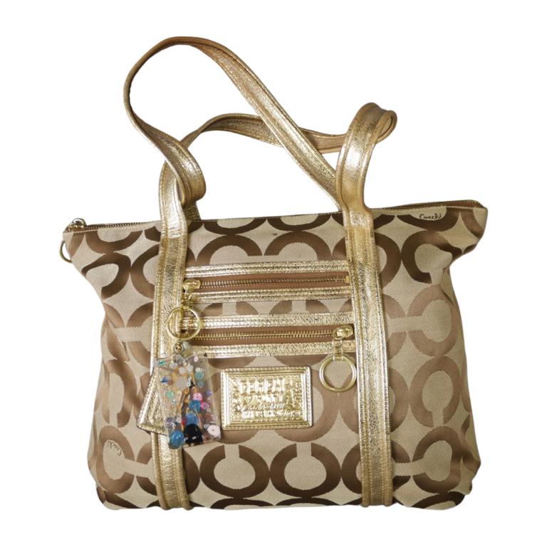 Coach Poppy Gold Brown Tote/ Handbag/ Bag: Coach Poppy Gold Brown Tote/ Handbag/ Bag. 15" x 12" x 5". Good overall condition. Esquis Auction does not have specialists on designer purses and handbags and we can not guarantee authenticity of the