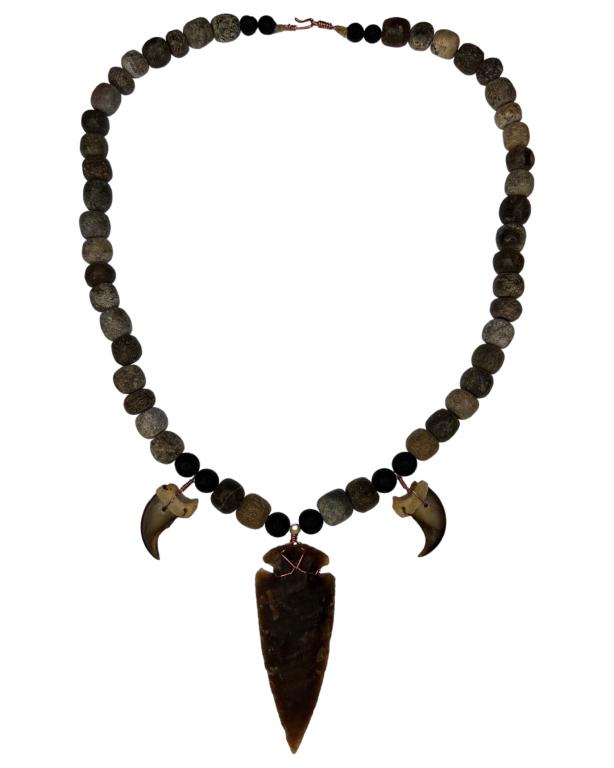 Fossilized Mastodon Bone & Lava Beads Necklace: Massive Necklace made from Fossilized Mastodon Bone Beads (35 Mil. Years), Lava Beads and Bear Claws. Pendant is Stone Knapped Knife Point (age unknown). Measures 25" long. Good Condition.