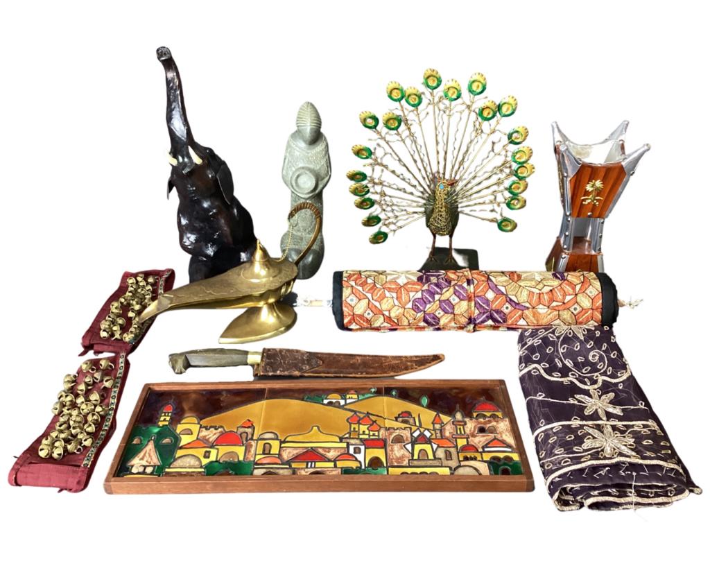 Middle Eastern Collectibles- Aladdin Lamp, Elephan: Group of Middle Eastern Collectibles- Brass Aladdin Lamp (Genie is still inside:)); Metal Crafted Peacock Figure, 3 Tile Framed Jerusalem View, Knive with Horse Head Carved Handle, Leather Seated Elep