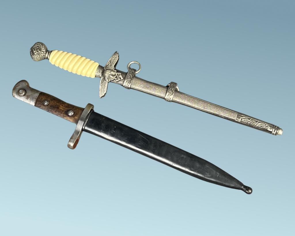 WWI German Bayonet & WWII Dagger Replica: Original WWI period German Bayonet by Gerb Weyersber Solingen and replica of WWII Nazi Dagger. 16"-16 1/2" long.
