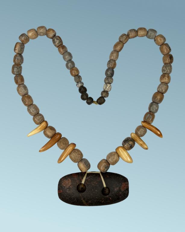 Mastodon Bone & Walrus Teeth Necklace w/ Hardstone: Necklace made of Carved Mastodon Bone Beads and American Walrus Teeth. Native American made Hardstone Gorget. 25" long. Good Condition.