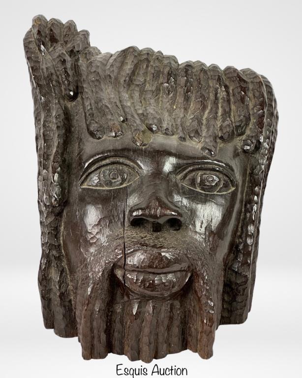 Jamaican Wood Carved Bob Marley Sculpture: Jamaican Wood Carved Male Face Sculpture- Looks like Bob Marley. Made of Solid piece of wood. Signed F.A. Jones, 1980 at the bottom. Measures 8" x 11" x 9". Good condition, natural wood cracks.