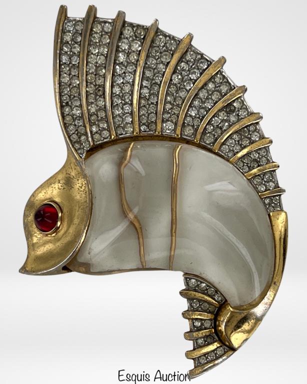 1940's Trifari Lucite Jelly Belly Fish Brooch/ Pin: Vintage 1940's Trifari Jelly Belly Fish Brooch by Norman Bel Geddes. Rhinestones fill the fin and tail. A red glass bullet cabachon eye. Stamped Trifari with the crown over the `T` on clip & Des Paten