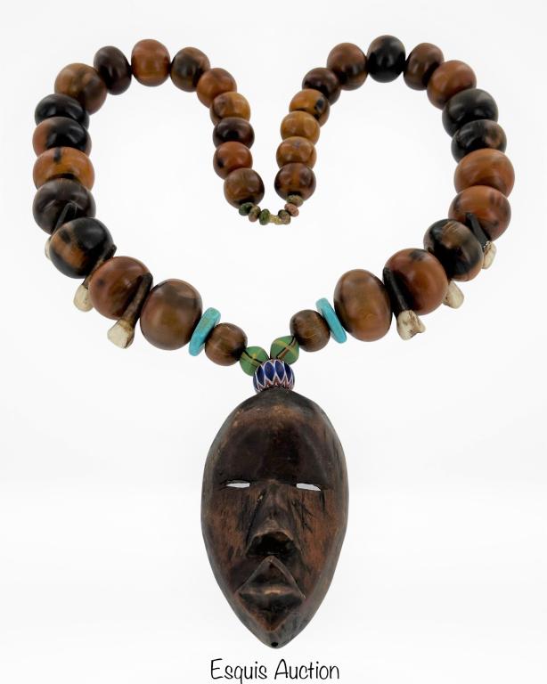 African Chiefs Necklace with Dan Wood Mask: African Chiefs Neckalce made of Horn Beads, Turquoise Beads, African Kings Beads (150 years old), Cape Buffalo Teeth Beads and Chevron Bead (over 150 years old). The Pendant is hand carved Dan Wood Ma