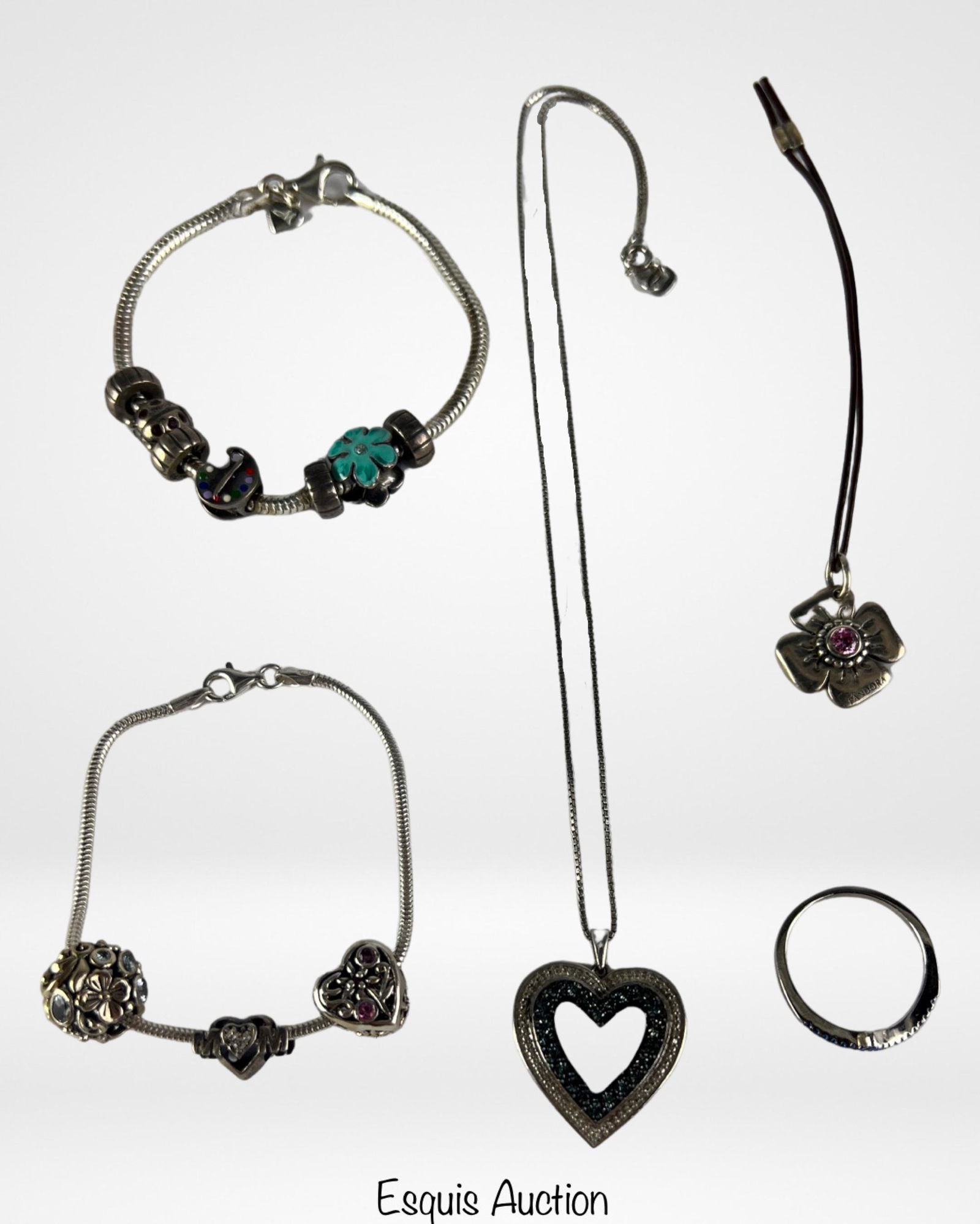 Sterling Silver Jewelry- Bracelets, Necklace, Ring: Group of Sterling Silver Jewelry- Two "Good Mood" Charm Bracelets, Pandora Flower Charm with Pink Stone, Heart Pendnant with Chain Necklace, Ring with Simulated Sapphires. Ring size-8. Good Condition.