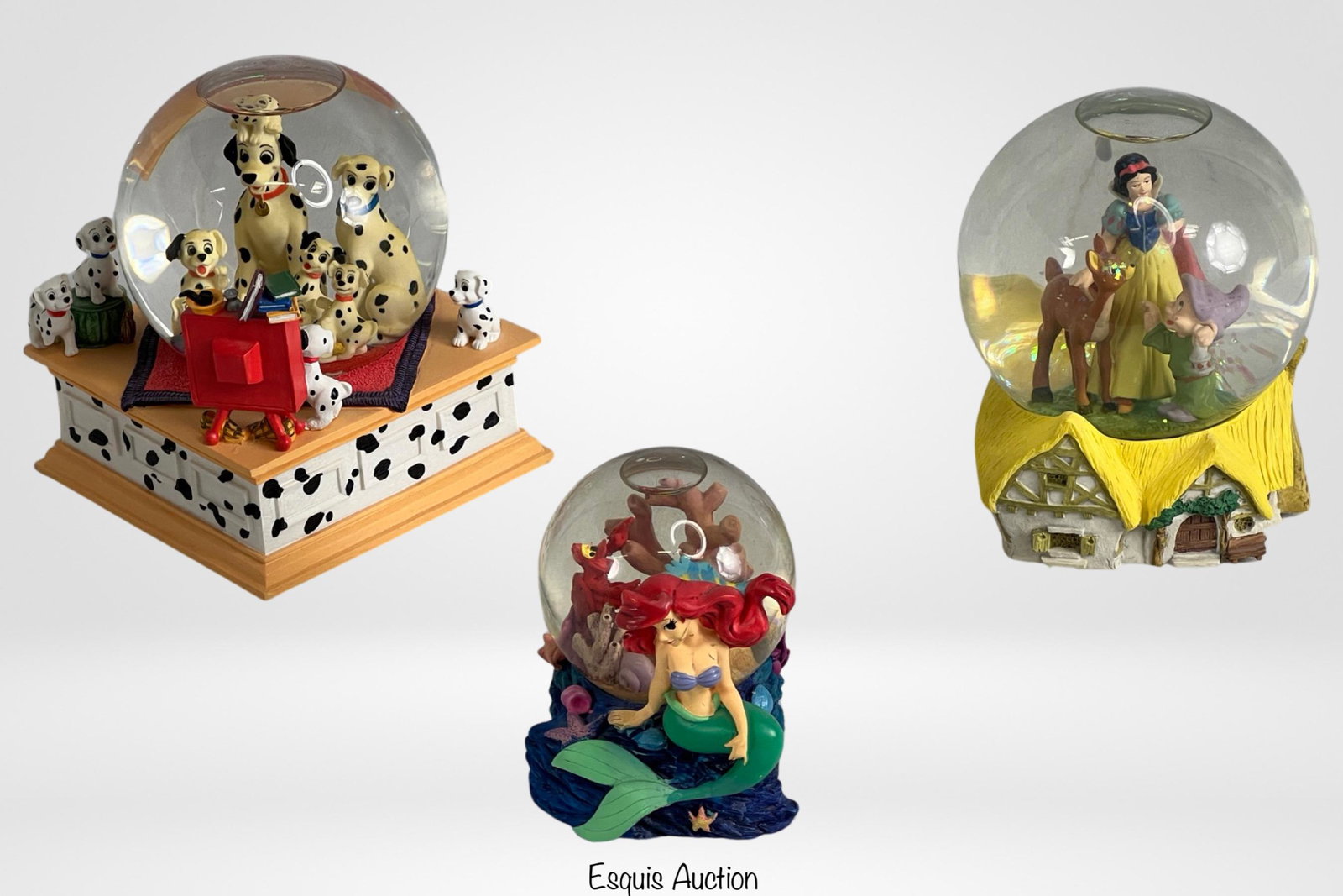 Disney's Snow Globes- Snow White, Dalmatians, Merm: Disney's Snow Globes- Snow White, 101 Dalmatians, Mermaids. 6.5-4" tall. Good Condition.