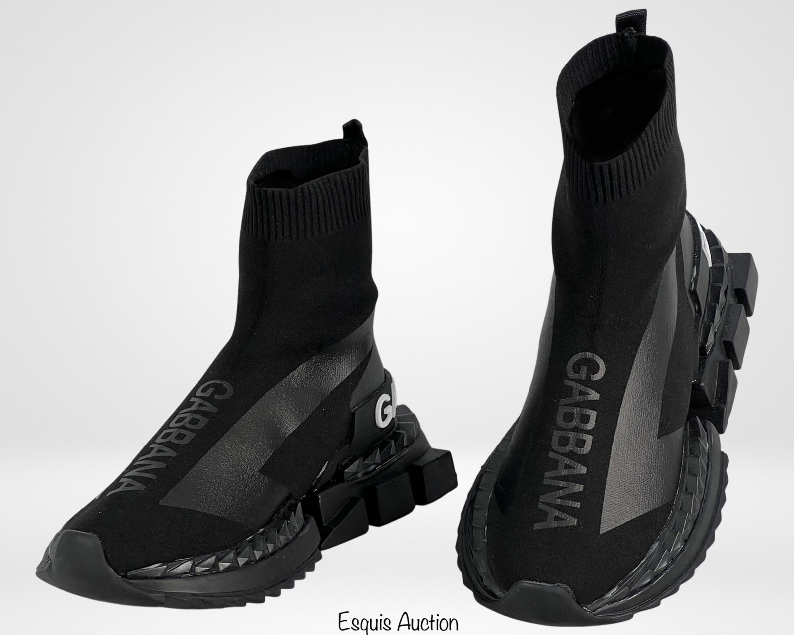 Dolce & Gabbana Black Sock Sneaker Boots Size 8: Elevate your street-style look with these fashionable Dolce & Gabbana boots, designed to make a statement with every step. These sleek boots feature a modern sock-like design that hugs your feet comfo