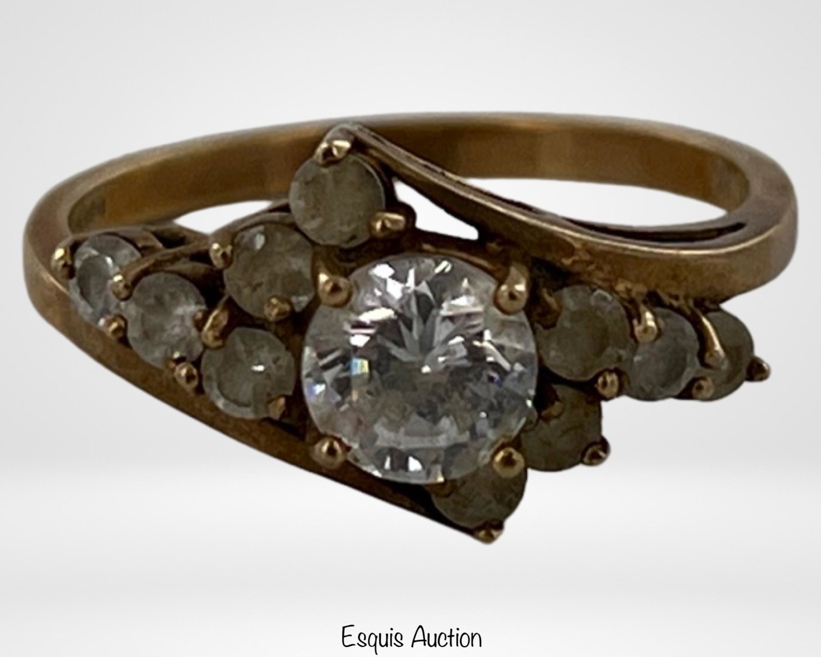 10k Gold Ladies' Elegant Ring: Add a touch of sophistication to your jewelry collection with this stunning 10k gold cluster ladies' ring. The ring features a beautiful arrangement of simulant diamonds, creating a captivating sparkl