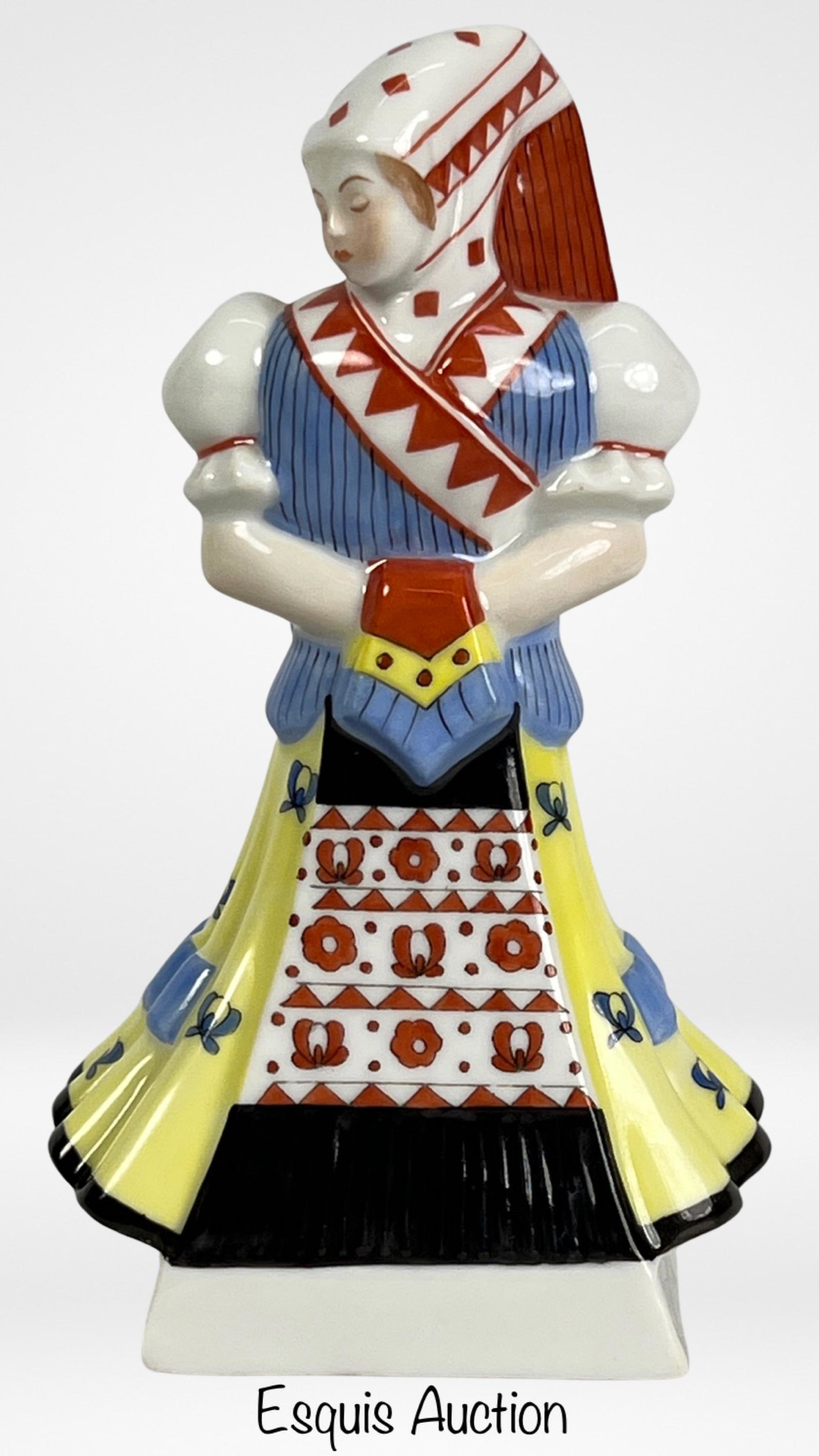 Herend Hungarian Lady in Folklore Dress Figurine: The Herend Hungarian Lady in Folklore Folk Dress Porcelain Figurine is a charming and elegant depiction of traditional Hungarian attire. Standing at 5 1/2" tall, this figurine showcases the renowned c
