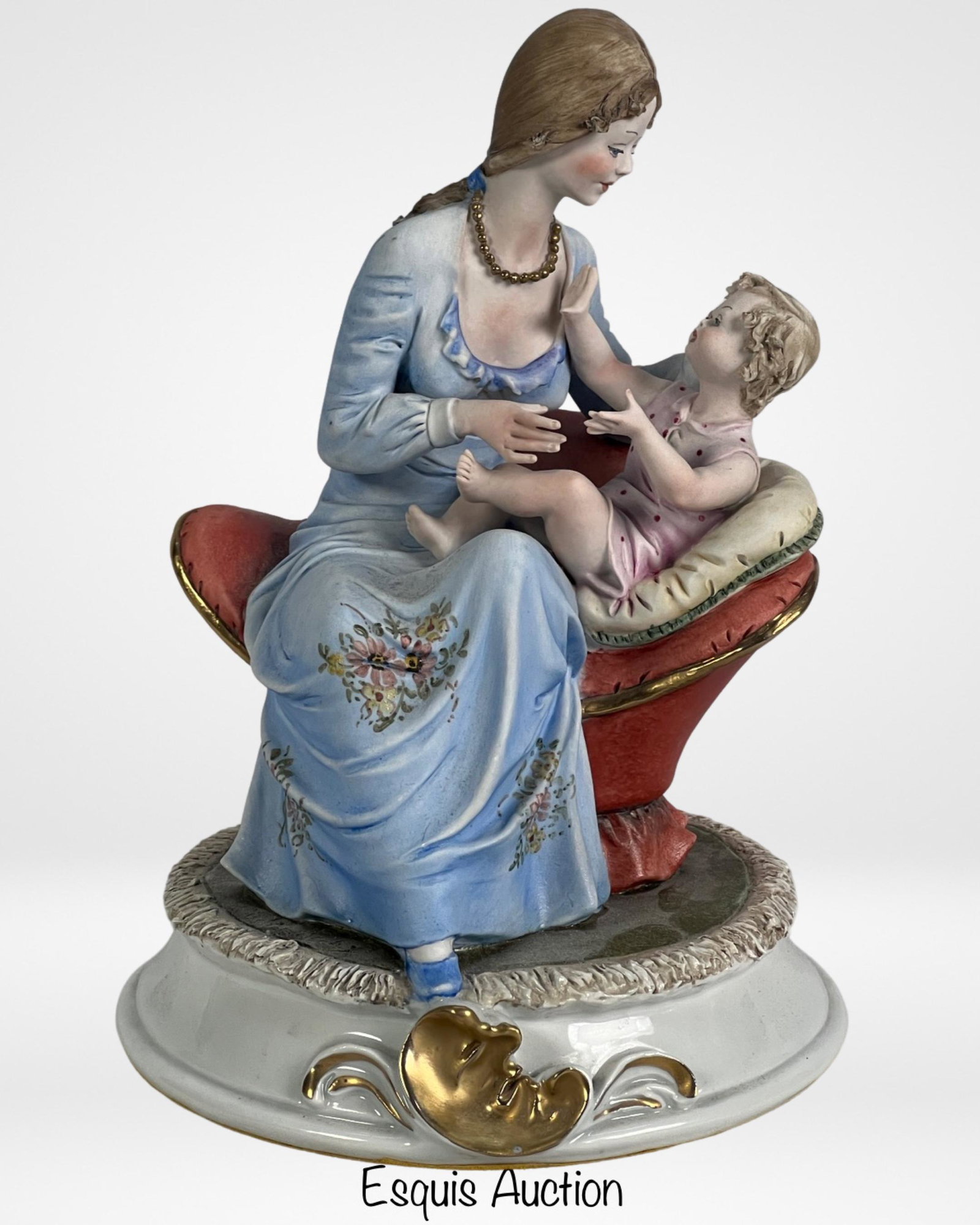 Capodimonte Mother & Child Fine Porcelain Figurine: This elegant Capodimonte Italy Fine Porcelain figurine showcases a tender portrayal of a mother and child. Crafted with exquisite attention to detail, the figurine stands at 9" tall, making it a delig