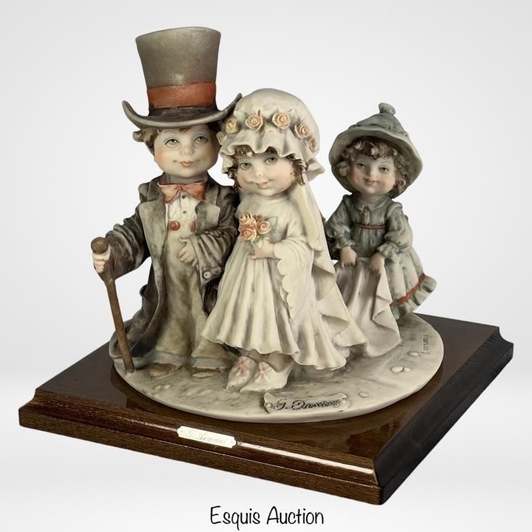 Giuseppe Armani- Wedding from Gulliver's World Fig: Step into the enchanting world of Giuseppe Armani with his captivating figurine, "Wedding from Gulliver's World" (Model-034). This handcrafted masterpiece showcases Armani's artistic brilliance and at