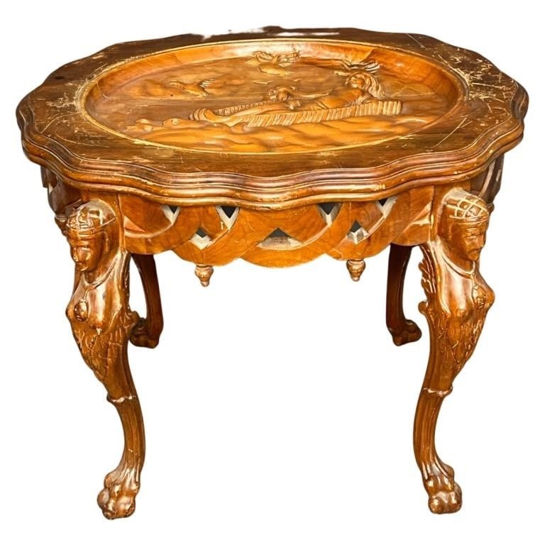 Antique Walnut Carved Side Table with Nude Scene: Elevate your living space with this Antique Walnut Carved Side Table, adorned with a beautifully carved nude lady on the top and intricately detailed siren legs standing atop lion paws. While this tab