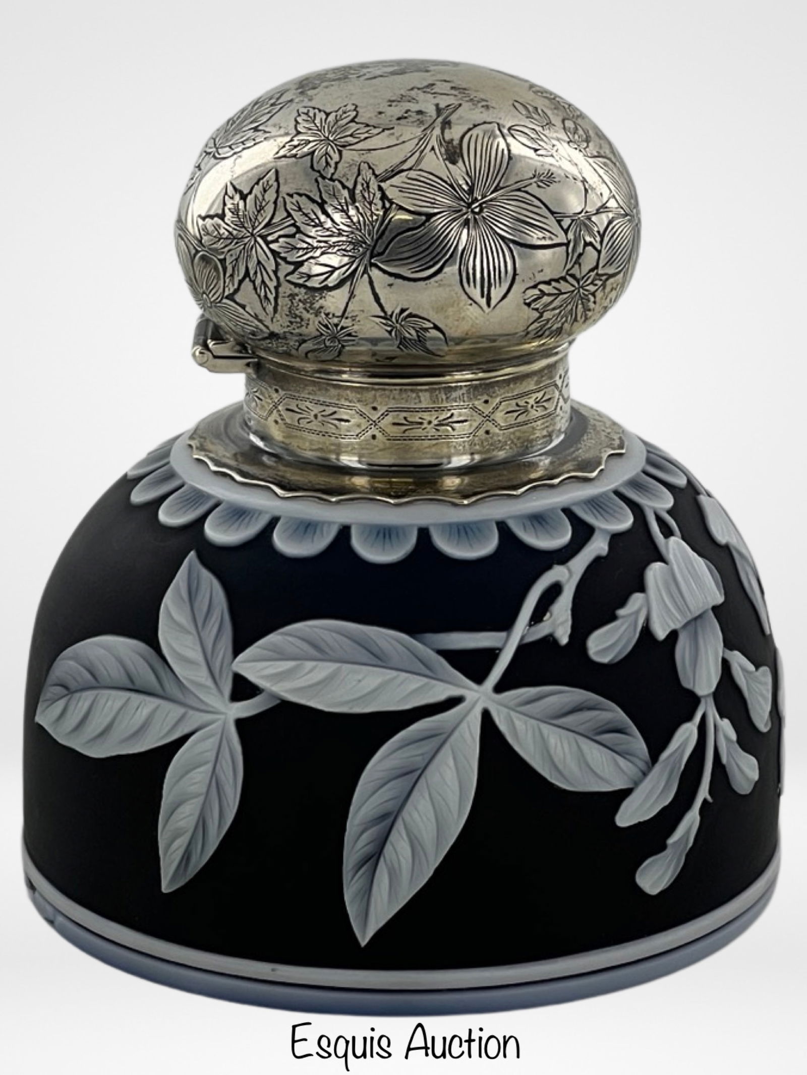 Thomas Webb Art Glass Cameo Inkwell w Sterling Lid: Elegance meets craftsmanship in this exquisite Thomas Webb Art Glass Cameo Inkwell Bottle. The Inkwell features a delicate floral design meticulously carved into the glass, revealing the artistry of T