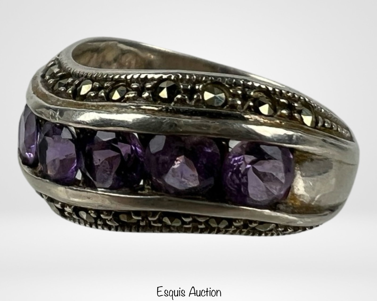 Sterling Silver Marcasite Amethyst Wavy Ring: Lady's Sterling Silver Marcasite studded Amethyst Wavy Ring. Size- 5 3/4