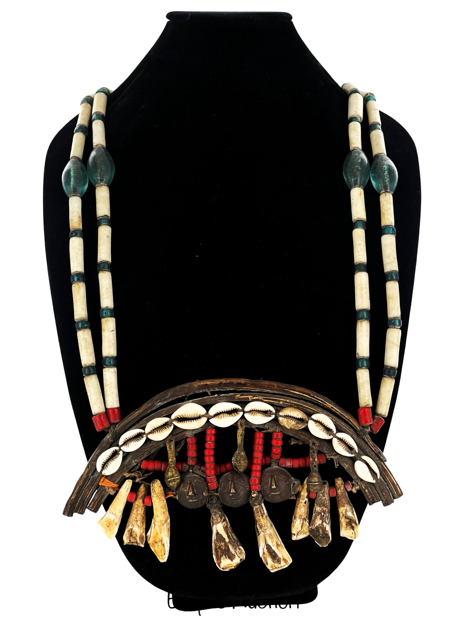 Antique Massive African Tribal Necklace: Discover the rich heritage and artistic expression of Africa with this exceptional Antique African Tribal Necklace. Crafted with meticulous detail and cultural significance, this necklace is a testame