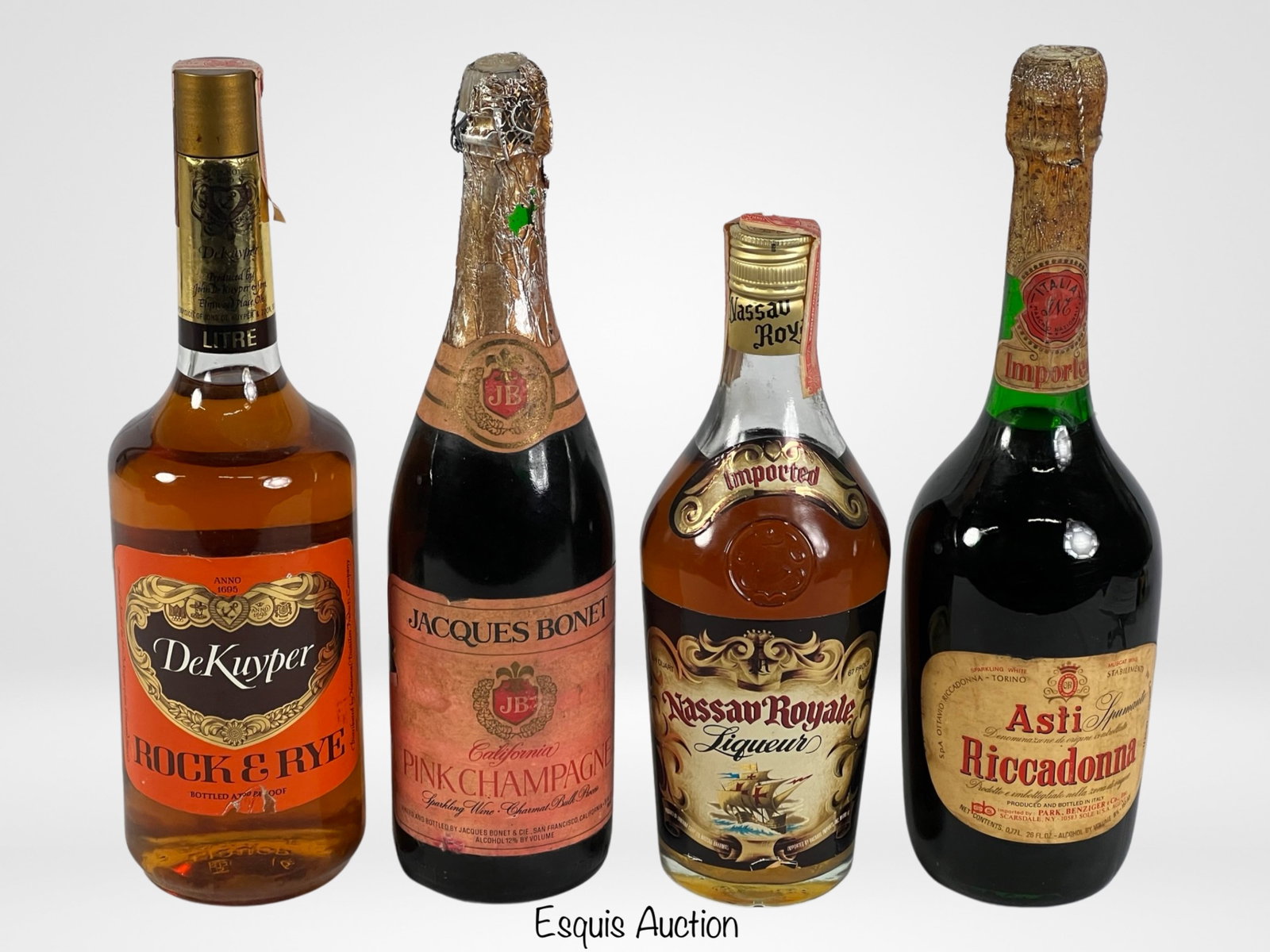 Vintage Liqueurs and Sparkling Wines from 1960's: Step back in time with this exquisite collection of vintage liqueurs and sparkling wines, all dating from the 1960s and still sealed to preserve their original charm. Each bottle is a glimpse into a b