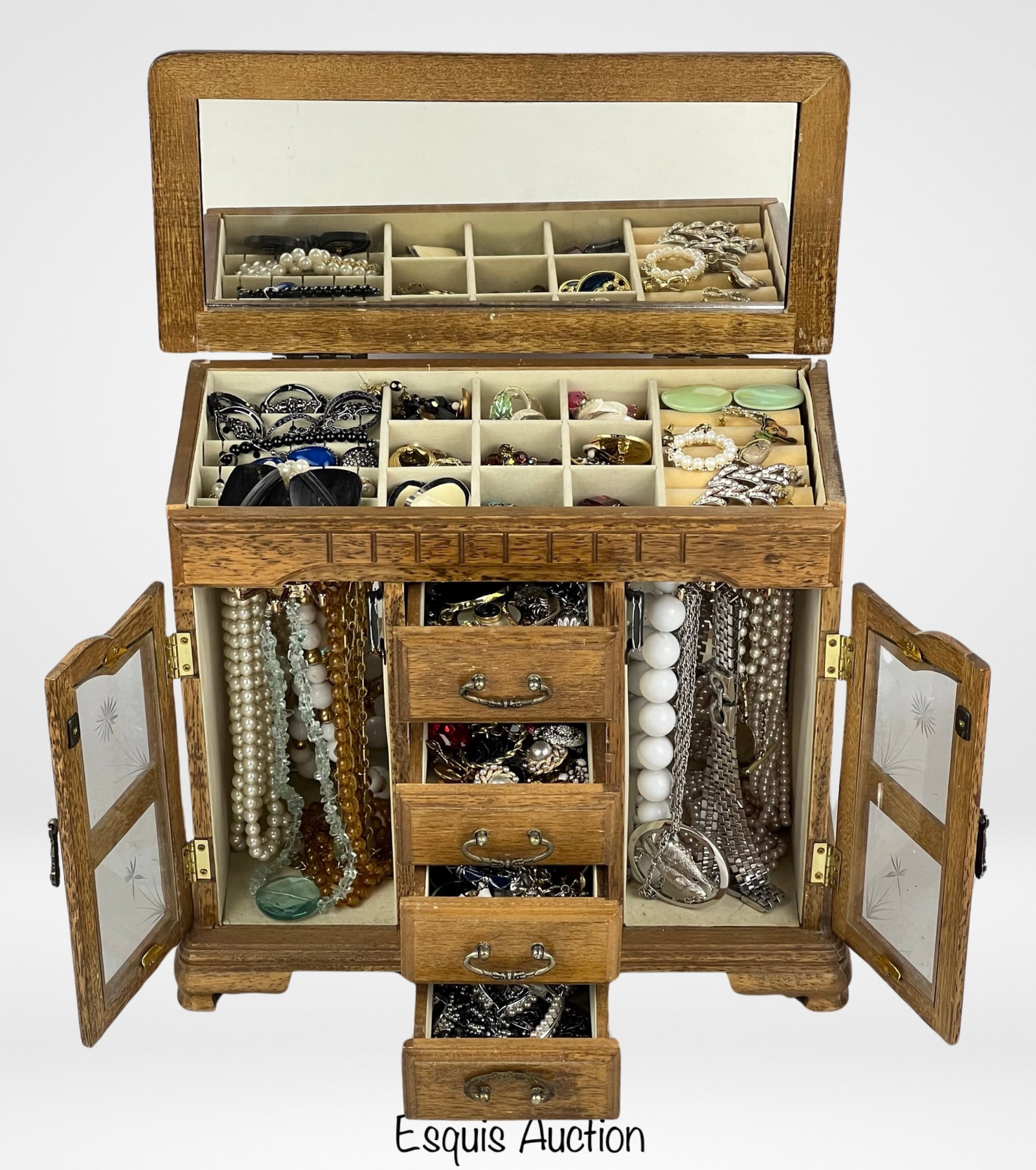 Vintage Wooden Box filled with Jewelry: Step into the enchanting world of bygone elegance with this vintage wooden jewelry box, lovingly filled with unsearched jewelry. This exquisite box is a nostalgic treasure chest that holds a delightfu