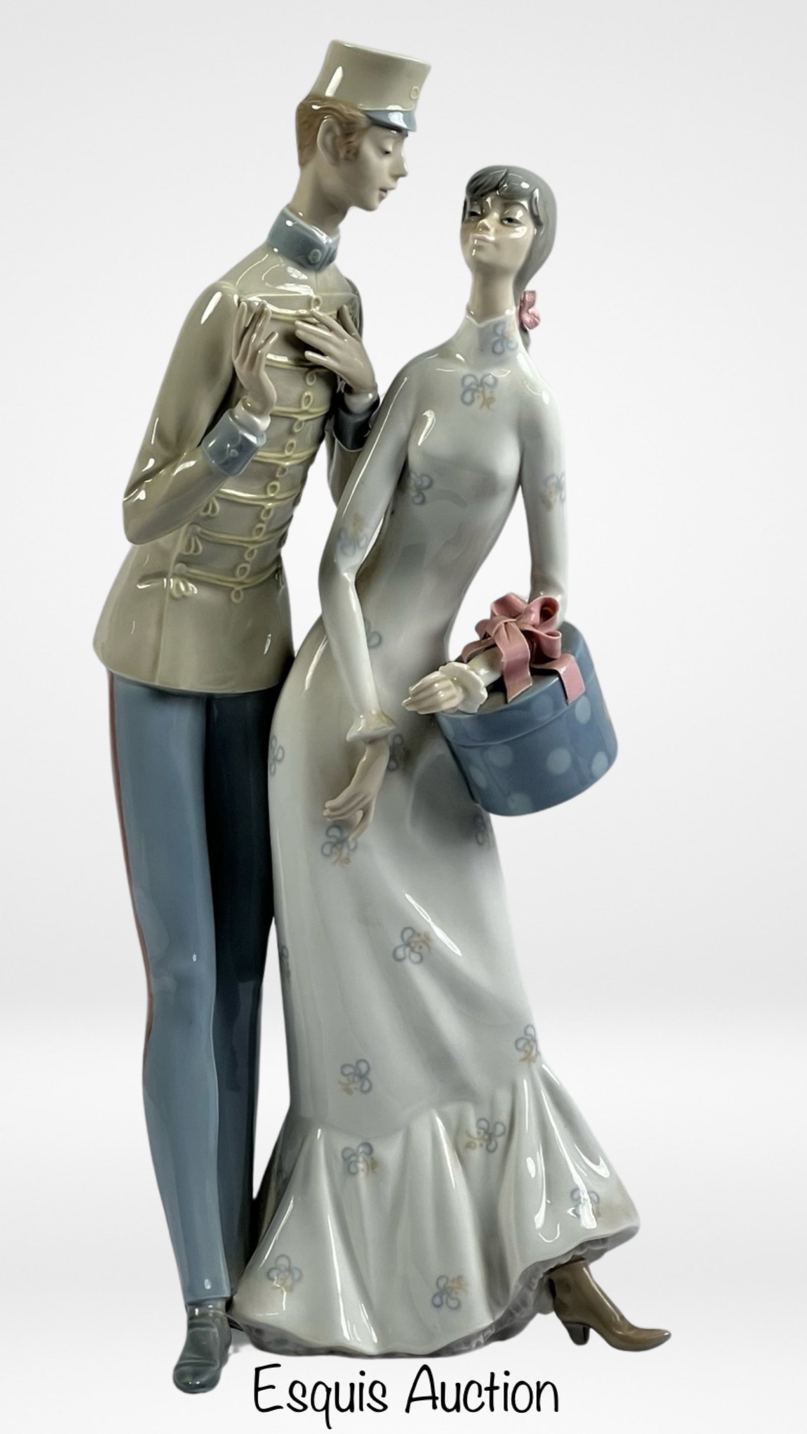Lladro "The Flirt" 4564 Porcelain Figurine: Elevate your porcelain collection with this exquisite Lladro figurine titled "The Flirt." Crafted with meticulous attention to detail, this piece is part of the esteemed Lladro Historical Collection, 