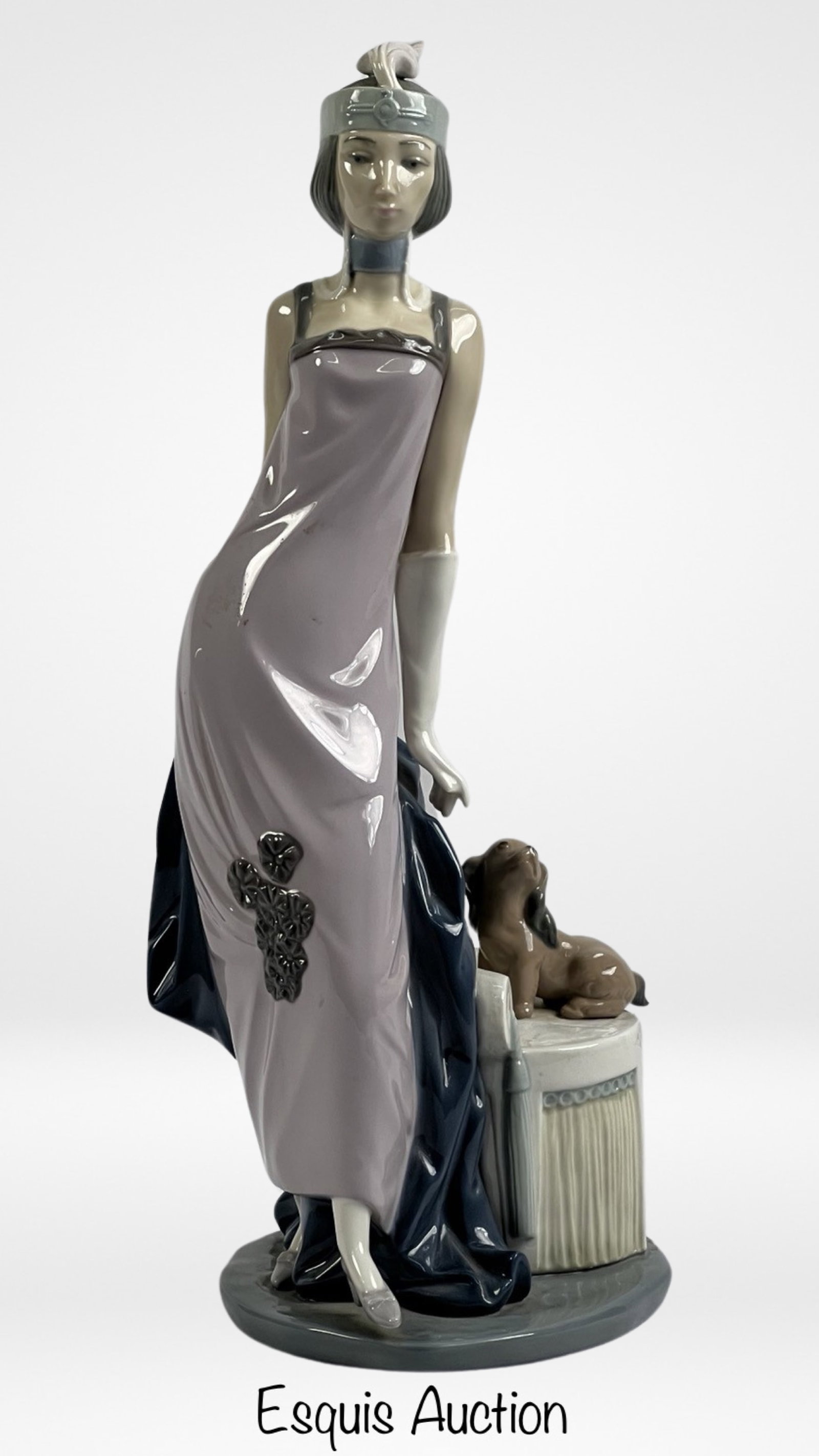 Lladro "Couplet Lady" 5174 Porcelain Figurine: Step into the glamour of the Art Deco era with the Lladro "Couplet Lady" 5174 porcelain figurine. This exquisite piece pays homage to the elegance and sophistication of the 1930s, capturing the essenc