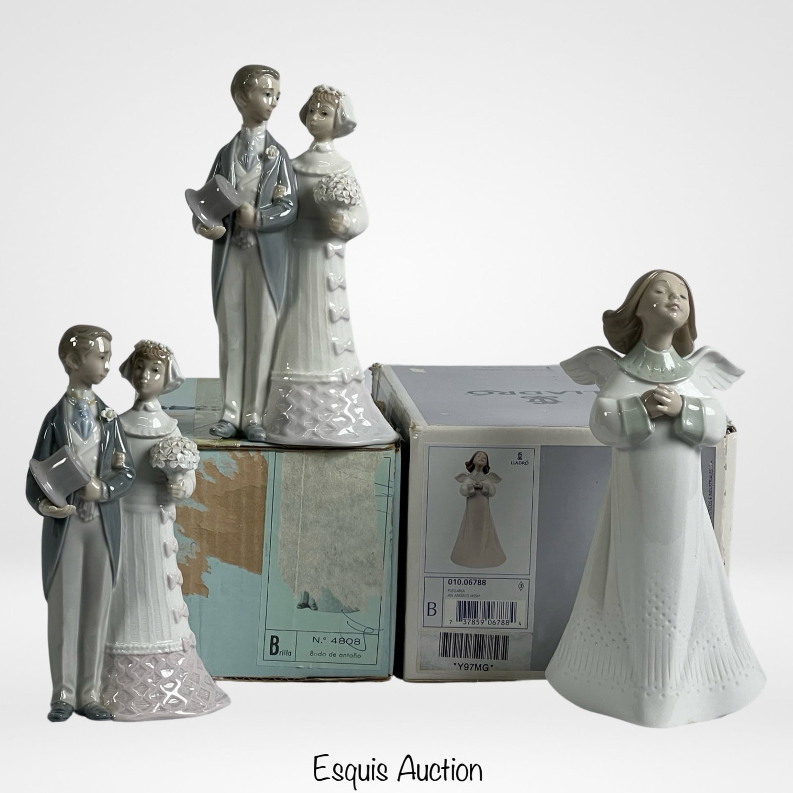 Lladro- 3 Porcelain Figurines- Angel's Wish & Brid: Celebrate the joyous moments of life with this enchanting Group of 3 Lladro Porcelain Figurines. Among them is the ethereal "An Angel's Wish" (6788), adorned with delicate details and presented in its