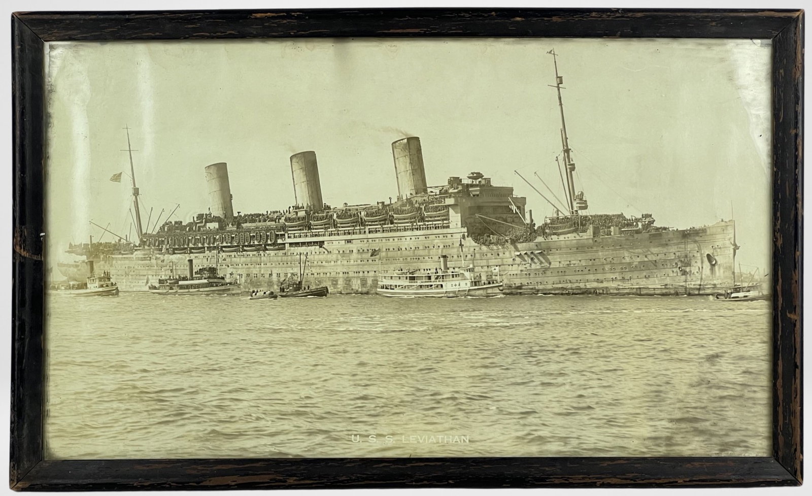 USS Leviathan WWI Original Dreadnought Photograph: This captivating original photograph of the "USS Leviathan" is a poignant representation of naval history during World War I. Taken by the accomplished photographer Enrique Muller, Jr., circa 1918, th