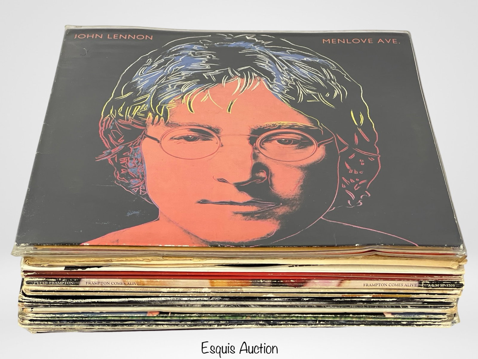 Iconic LP Vinyl Records- Beatles, Doors, Rolling S: Delve into the timeless allure of music with this exceptional lot of iconic LP vinyl records, featuring legendary artists that have left an indelible mark on the world of sound. From the soulful melod