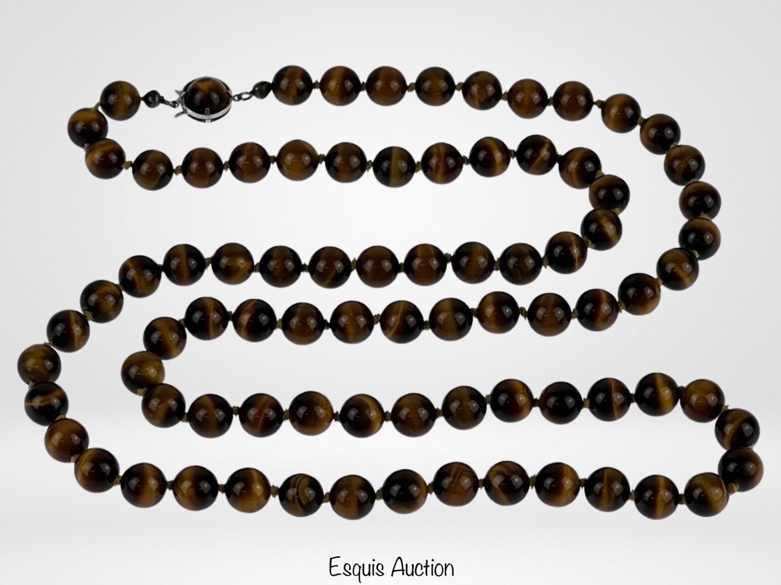 Tigers Eye Beaded Neckalce with Sterling Silver Cl: Tigers Eye Beaded Neckalce with Sterling Silver Clasps. 32" long. Good Condition.